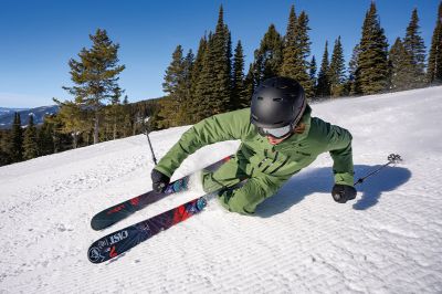 Model skiing down a mountain.